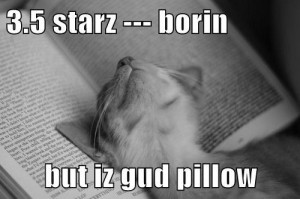 Kitteh sleeping on book - 3.5 starz - borin but iz gud pillow